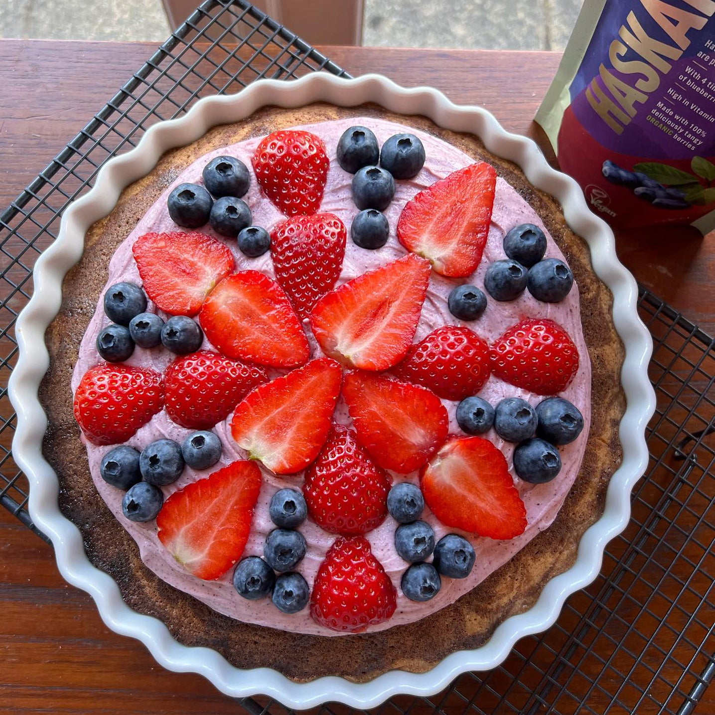 A colourful cake with a Union flag pattern made using Haskapa