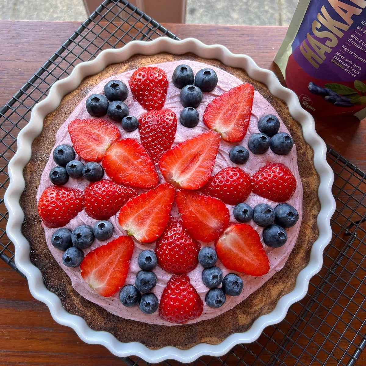 A colourful cake with a Union flag pattern made using Haskapa